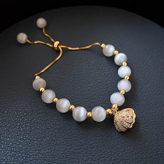 Pulsera de Concha con Perlas en Oro