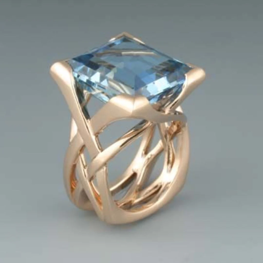 Anillo vintage de oro rosa con circonita azul